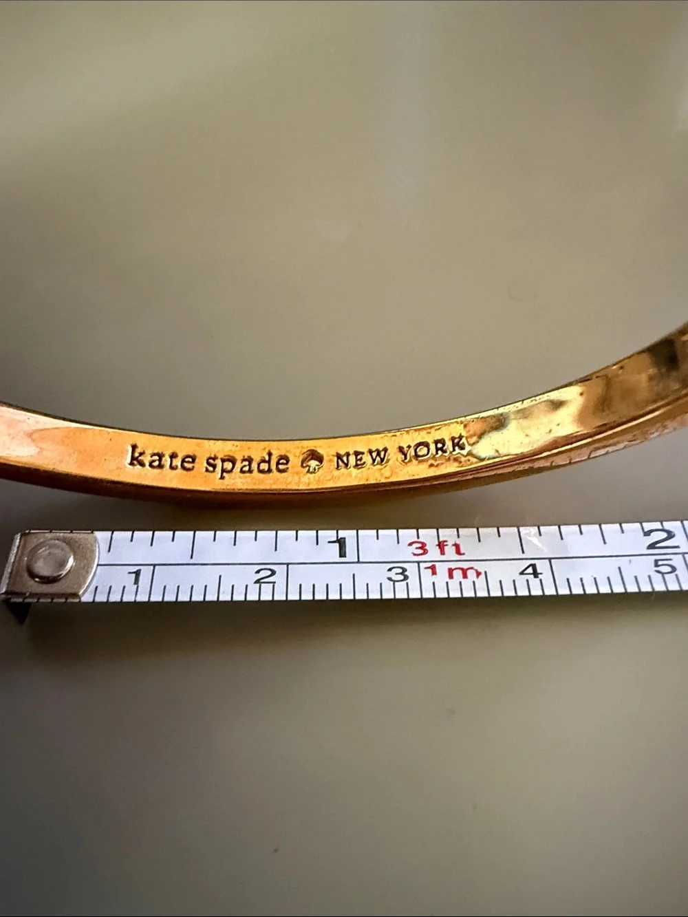 kate spade Gold Bow-Embossed Bangle Bracelet